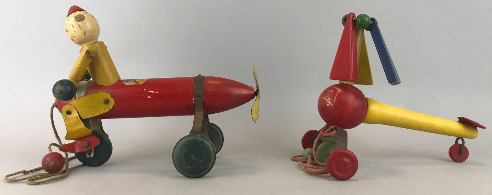 Group of 2 pull-along toys: Luster Toy Corporation-Sterling, Illinois and Pull-a-Copter Kohner Bros NY. Largest is 9x7.25 inches