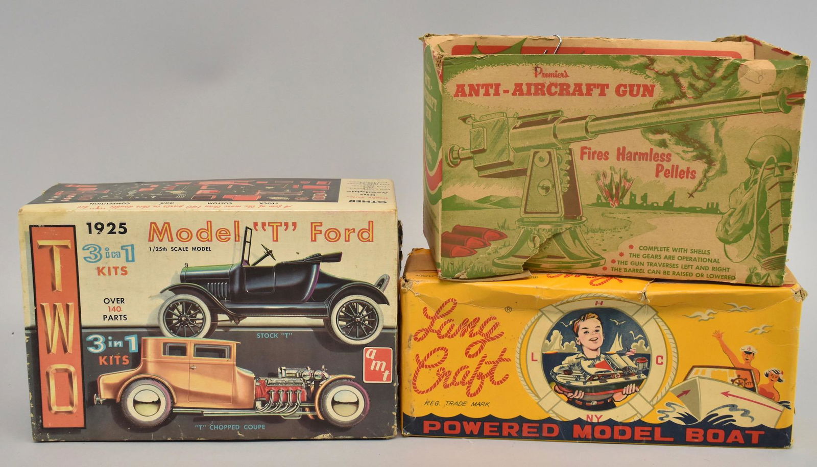 Group of 5 empty toy boxes: All boxes are empty. Lang craft model boat, Model T Ford, anti aircraft gun, Lil Abner dogpatch band