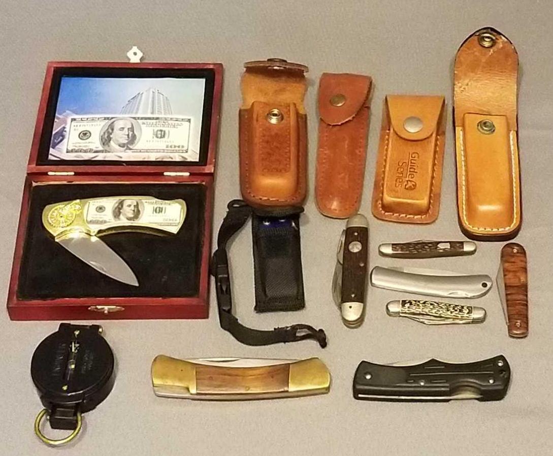 Group of pocket knives, sheaths and more: Compass, empty sheaths. Largest knife is 5.75 inches