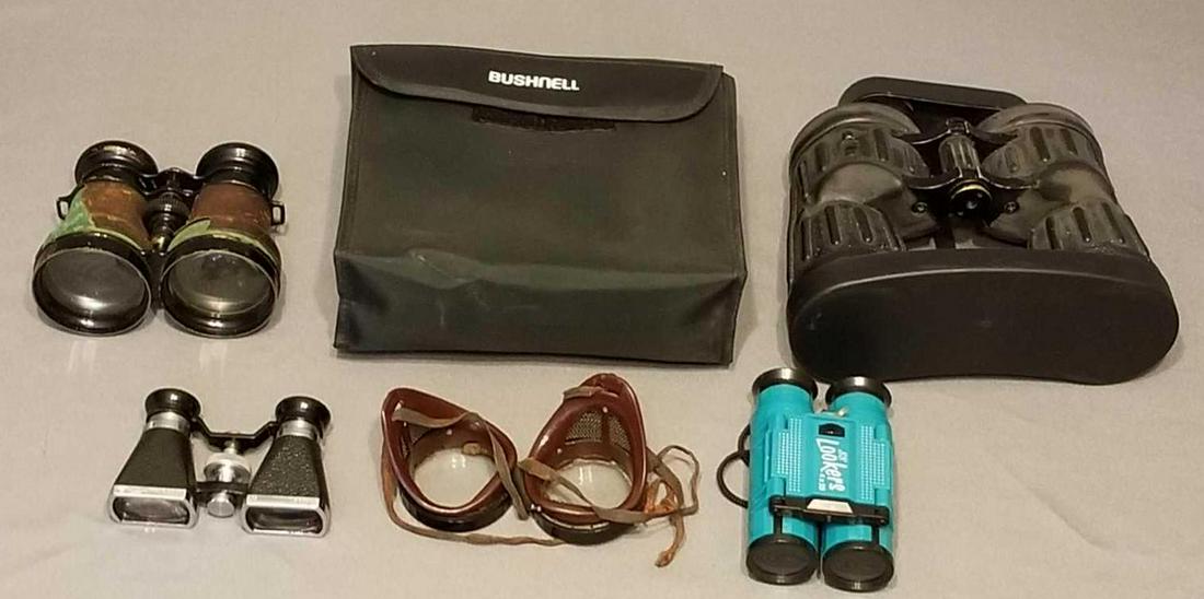 Group of binoculars and goggles: Various styles and sizes.