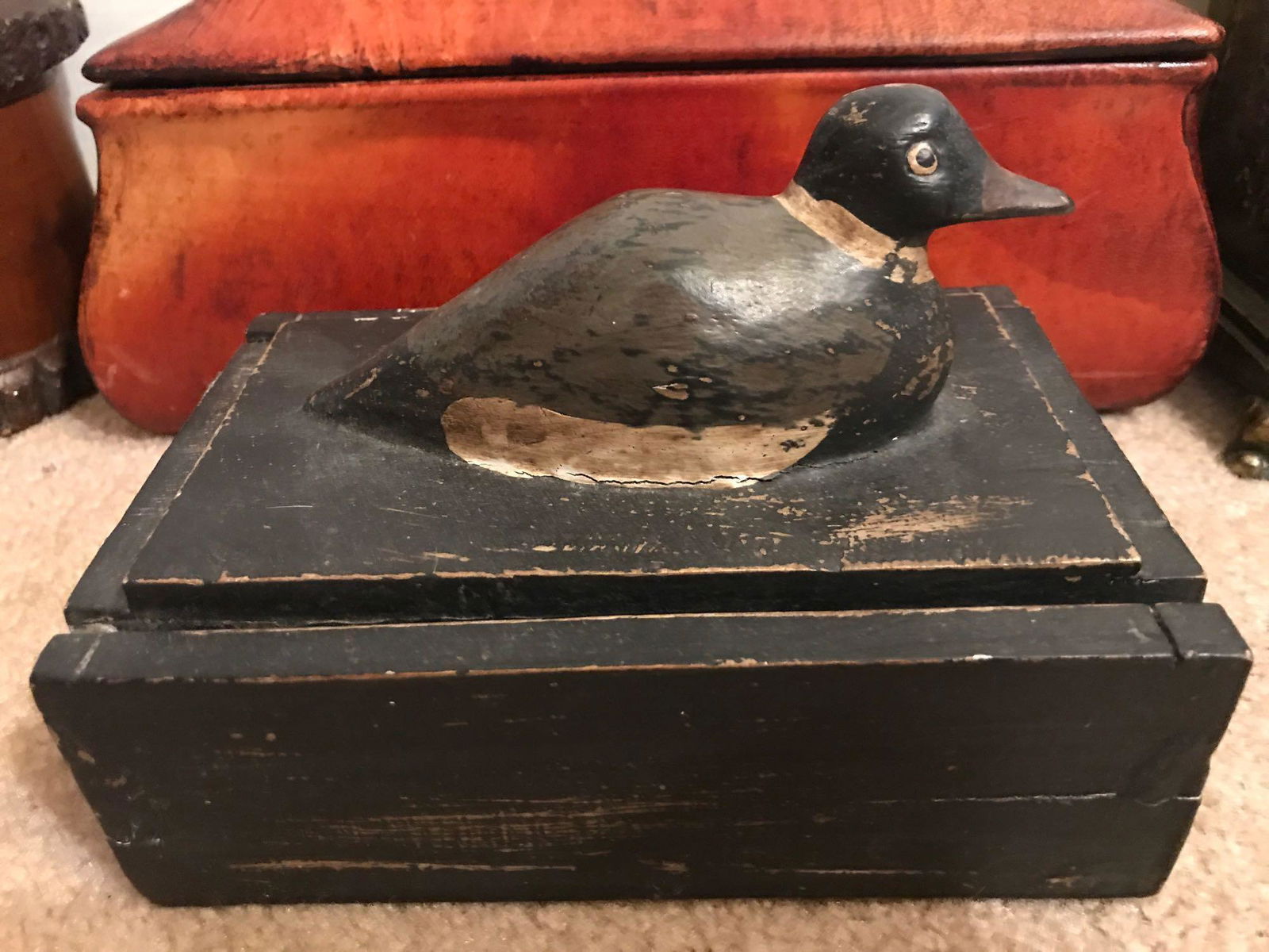 4 piece group of assorted decorative boxes: Wood, ceramic, resin. Largest is 13.25x5x7 inches