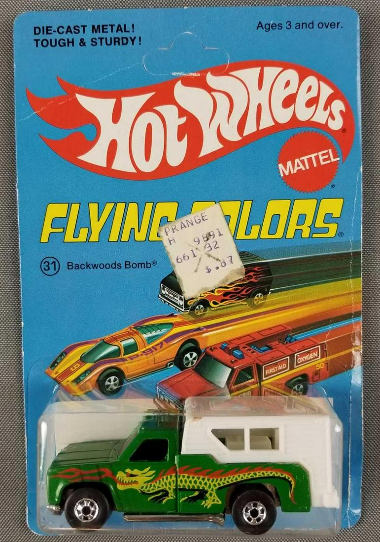 Hot Wheels Flying Colors Backwoods Bomb 31: Die cast vehicle in original packaging. Made in Hong Kong, 1974 Mattel, unpunched, Green Body with Dragon Decals.