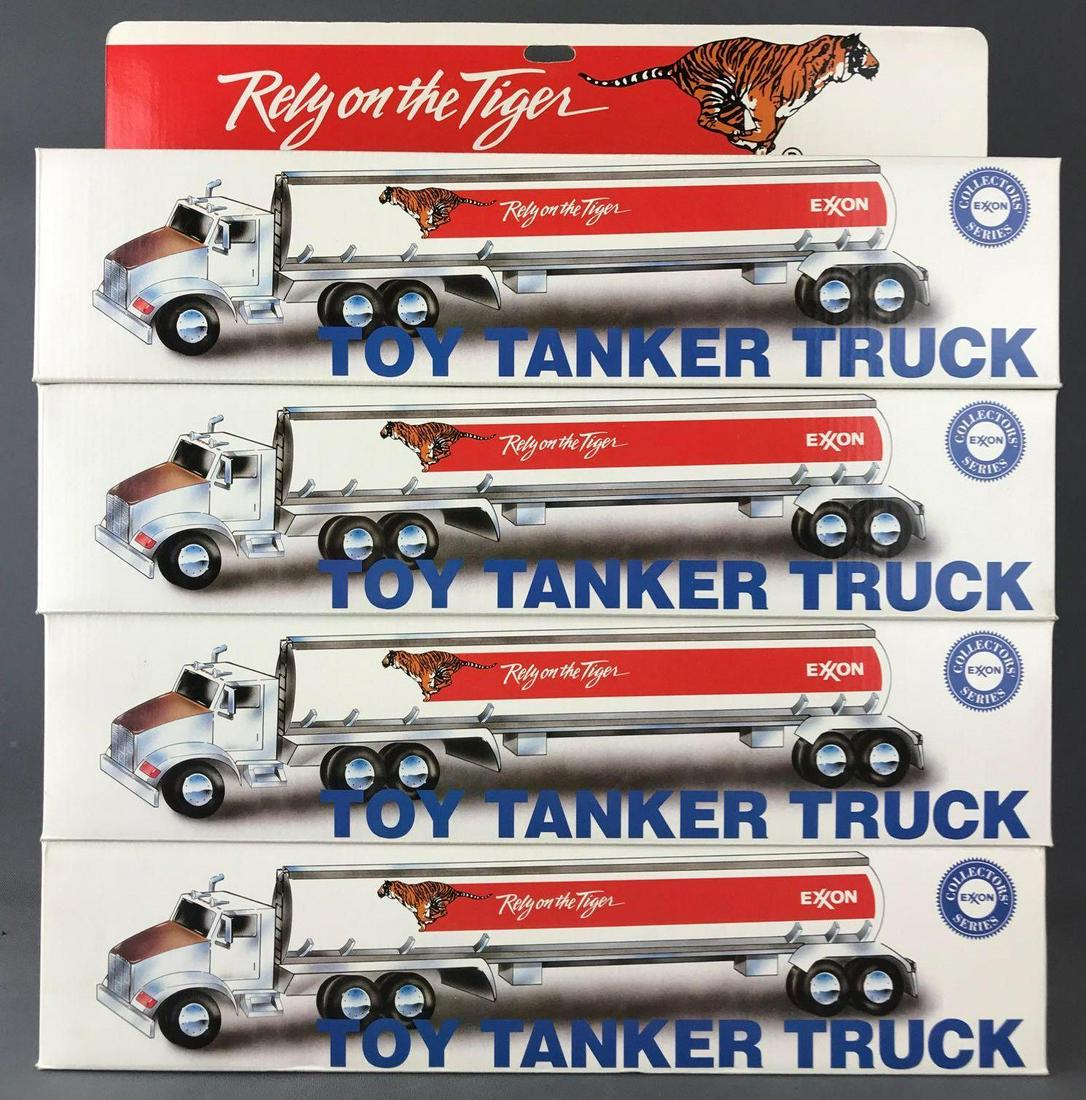 Group of 4 Exxon Collectors Series Toy Tanker Trucks: New in original packaging, working lights and sound