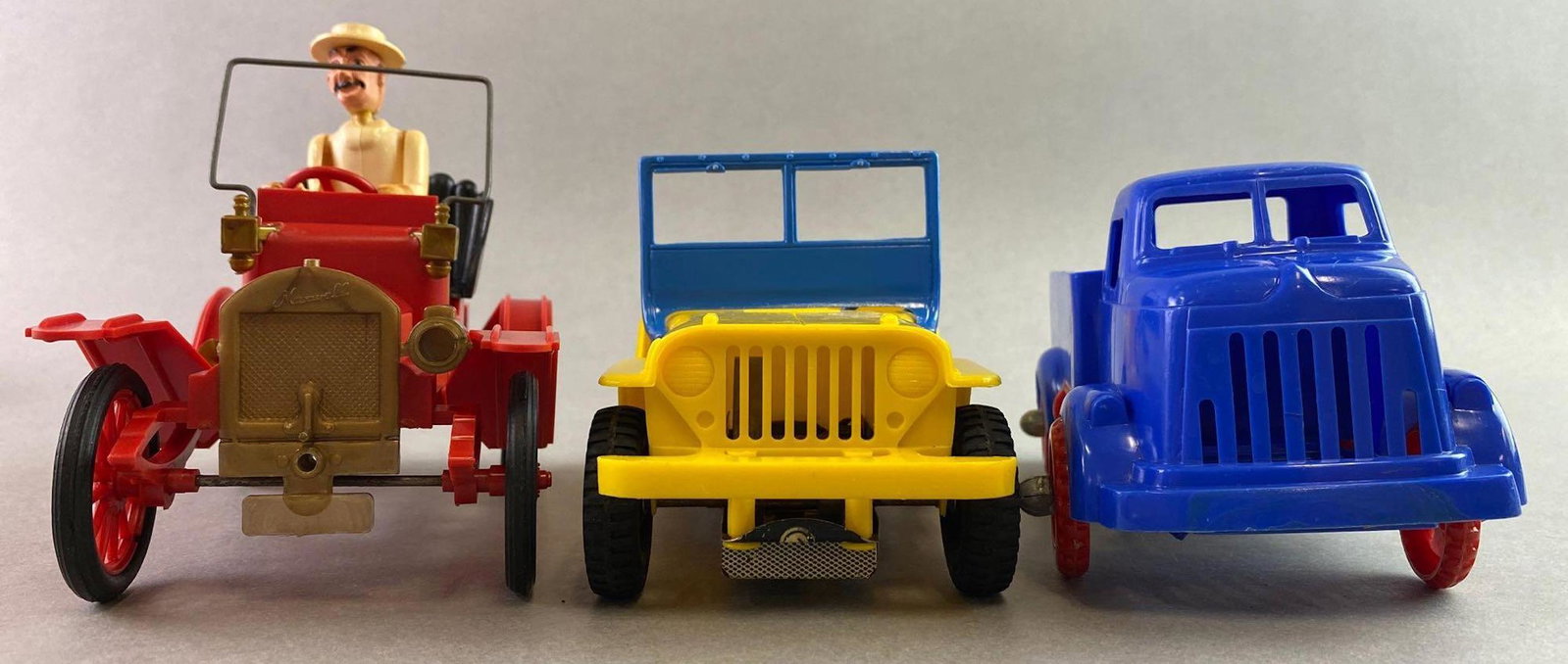 Group of 3 Vintage Automobile Toys: The blue truck club was made by ideal and has four compartments and a tire and jack. Measures approximately 8 inches long. Yellow vehicle is a friction toy made by Mar Toys and measures approximately 