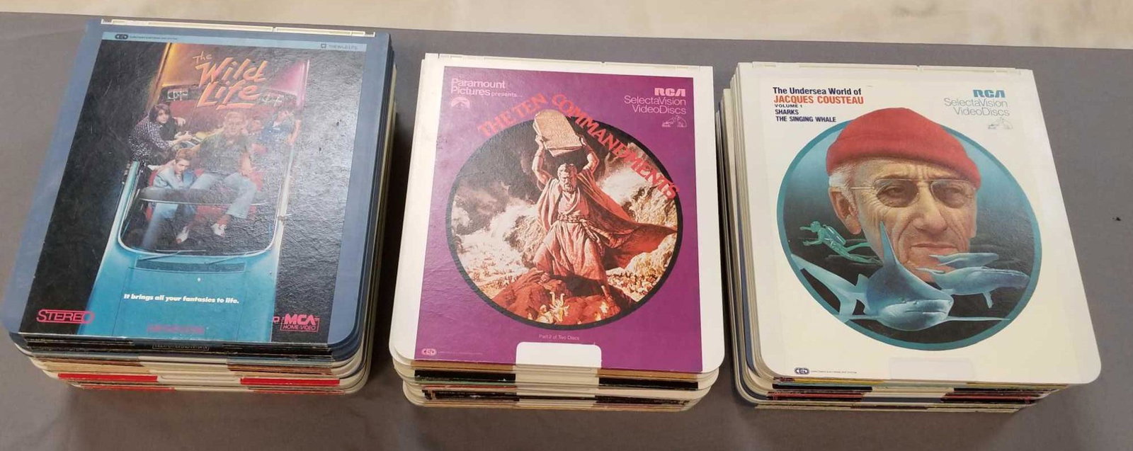 Large group of CED videodiscs: Disney, Muppets, Pink Panther, Three Stooges, Wargames and more. Pick up is recommended, group is heavy.