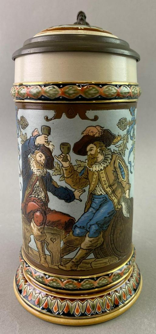 Antique Mettlach Stein 1/2 Liter Old German Drinkers: Approximately 8 1/2 inches tall. Incised design of two friends drinking together. Entitled â€œOld German Drinkers” Marked Mettlach 1932 II 96 34. The pewter lid is tight and closes snugly.