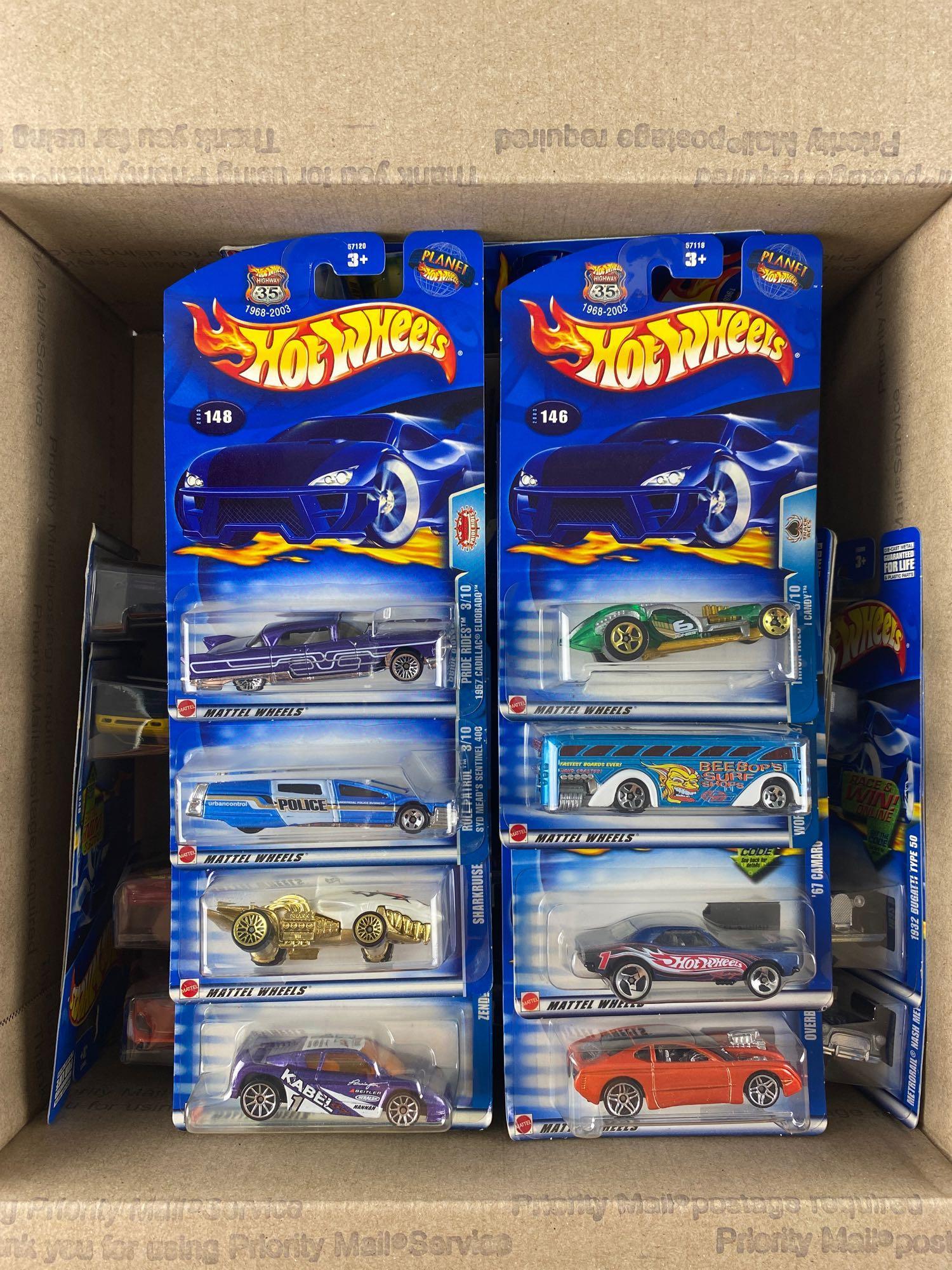 Group of 40 assorted Hot Wheels die-cast vehicles: Includes Zender Fact 4, Jaguar D-Type, 1932 Bugatti Type 50, and more. New in original packaging. Mattel, Inc.
