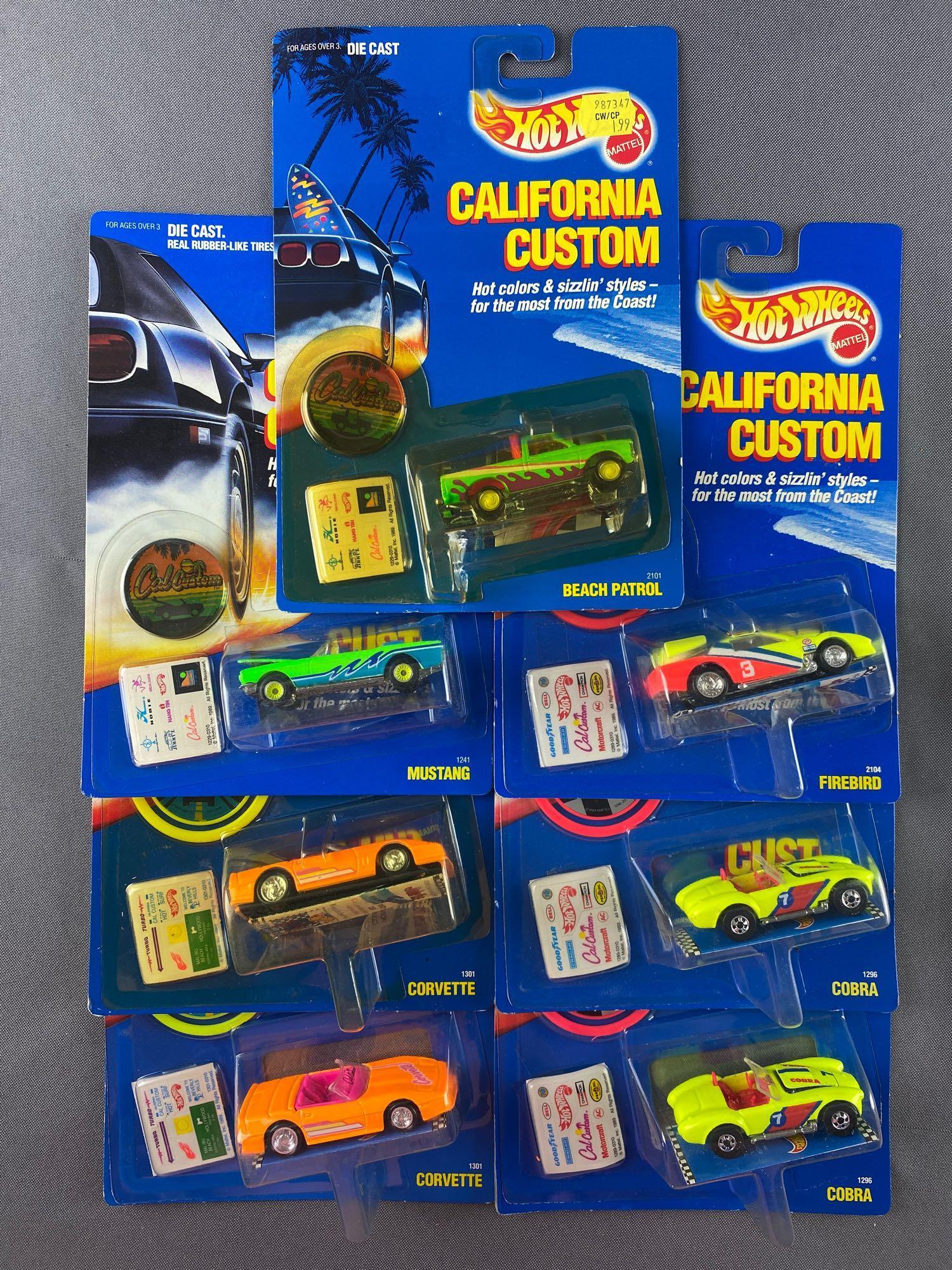 Group of 7 Hot Wheels California Customs die-cast: Includes Beach Patrol, Firebird, Mustang, Cobra, and Corvette. New in original packaging. Made in Malaysia. 1989 Mattel, Inc