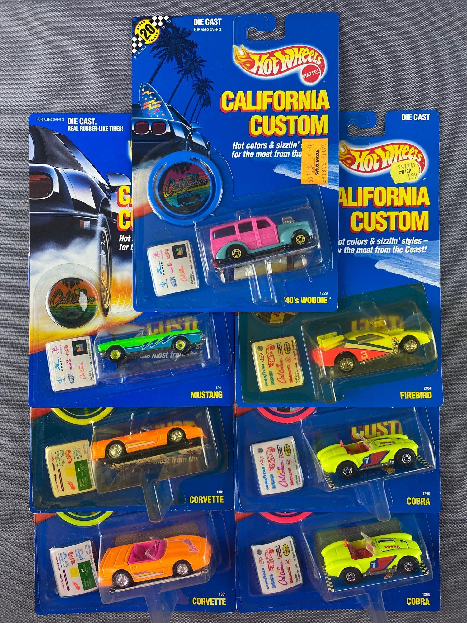 Group of 7 Hot Wheels California Customs die-cast: Includes Cobra, Corvette, Mustang, Firebird, and 40s Woody. New in original packaging. Made in Malaysia. 1989 Mattel, Inc