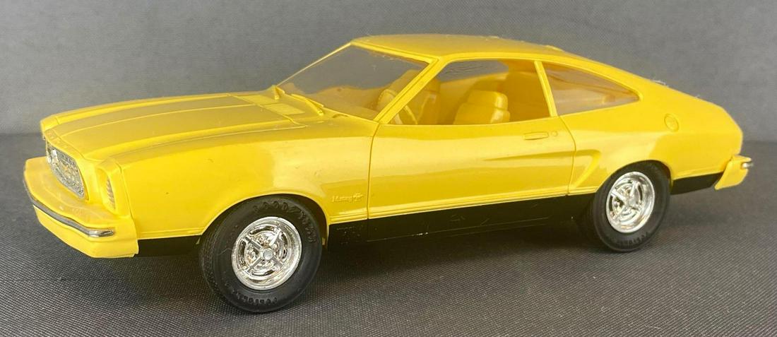 1975 Ford Mustang Mach I Dealer Promo Car: Yellow body and interior, appx 7x2.5x2.25 inches, non-friction
