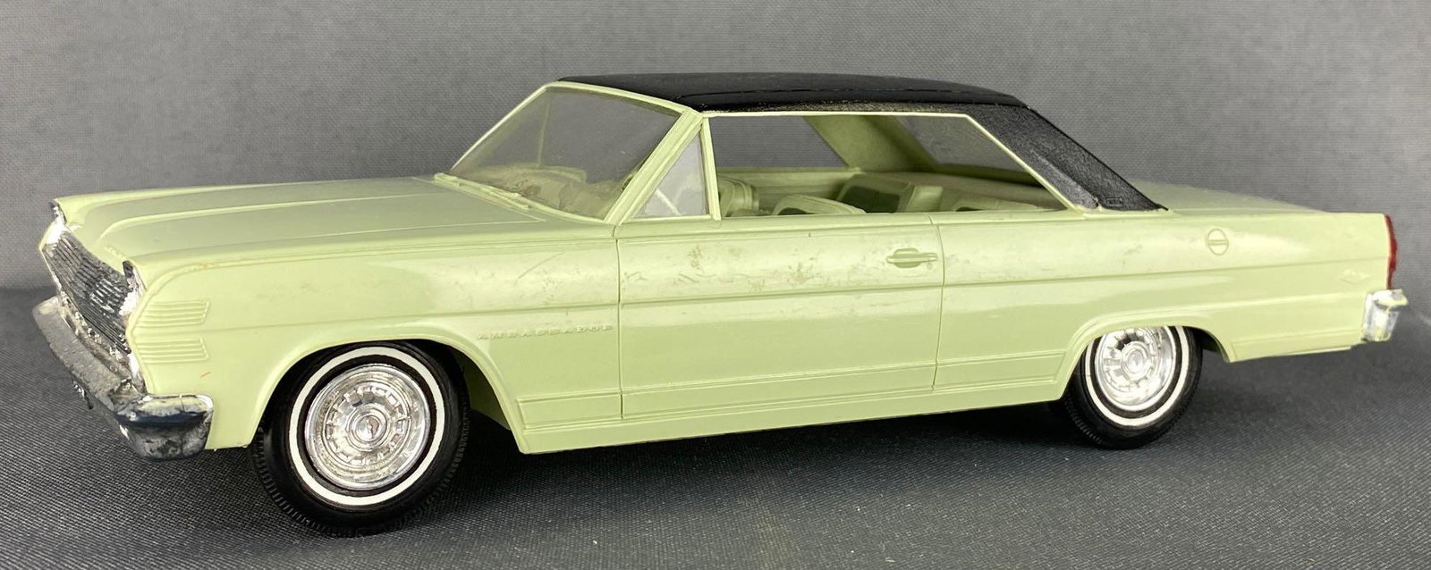 1966 AMC Ambassador Dealer Promo Car: Light green body and interior, black top. 8.25x3x2.25 inches, working friction