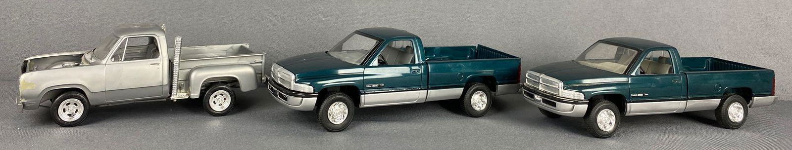 Group of 3 Dodge Pickup Dealer Promo Cars: Includes (2) 1995 Dodge Ram 2500 V10-Green/Silver and (1) Dodge pickup-Silver. Largest is appx 9x3.25x3 inches, all non-friction
