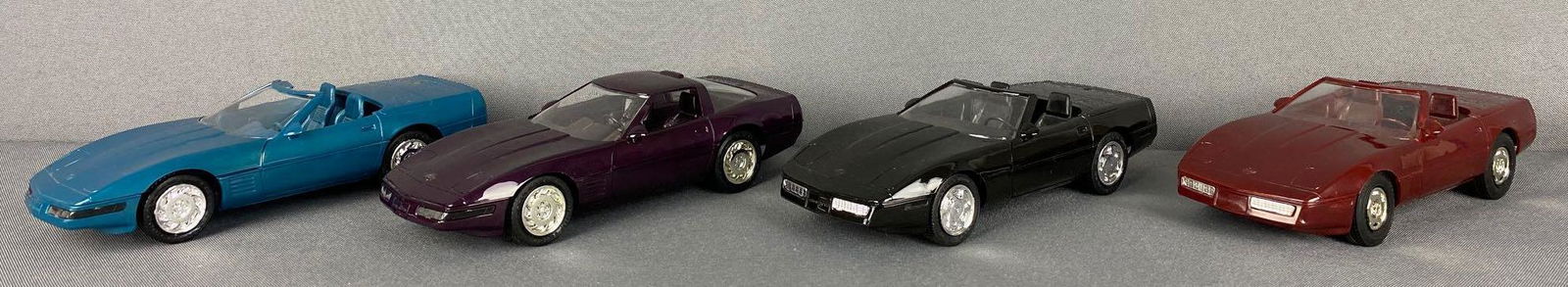 Group of 4 Chevrolet Corvette Dealer Promo Cars: Includes 1994 Corvette Convertible-blue, 1993 Corvette ZR1-purple, 1989 Corvette Convertible-black, and 1988 Corvette Convertible-burgundy. Appx 6.75x2.25x1.75 inches each, all non-friction