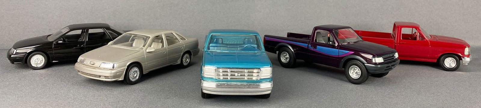 Group of 5 Ford Dealer Promo Cars: Includes 1989 Taurus SHO-silver, 1992 F150-blue, 1994 F150 XLT-red, and more. Largest is appx
