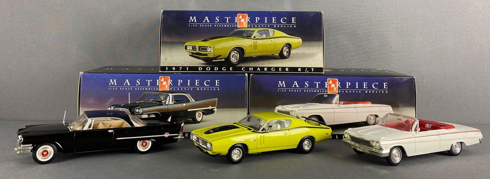 Group of 3 AMT Masterpiece replica vehicles: 1/25 scale assembled plastic replica vehicles, 1971 Dodge Charger R/T, 1957 Chrysler 300C, and 1962 Chevrolet Impala. All like new in original packaging