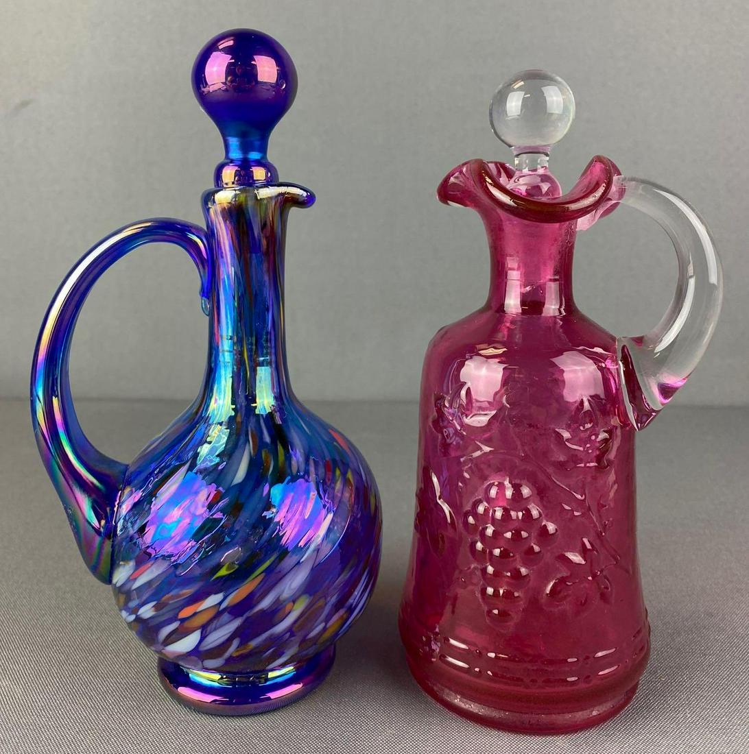 Group of 2 Gibson Glass Cruets: Pink colored and splatter, include stoppers, largest is approximately 7.75 inches tall and has pontil mark