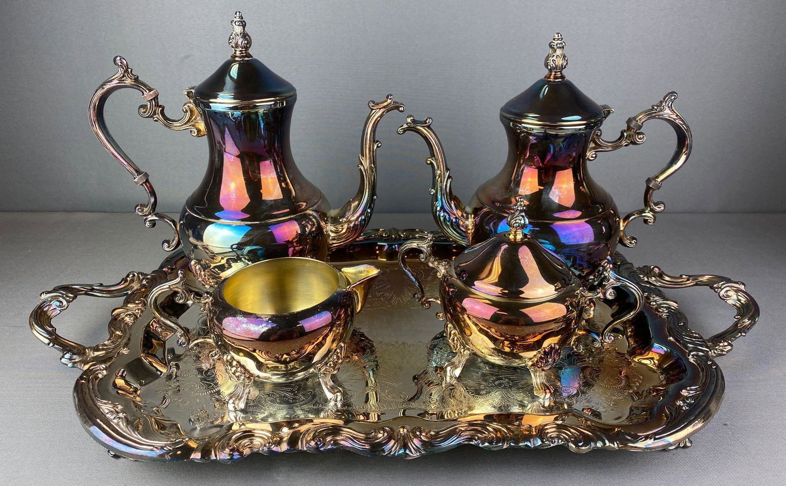 Group of Silverplate Tea Set, Champaign Bucket, and: Includes 2 pots, sugar and creamer container