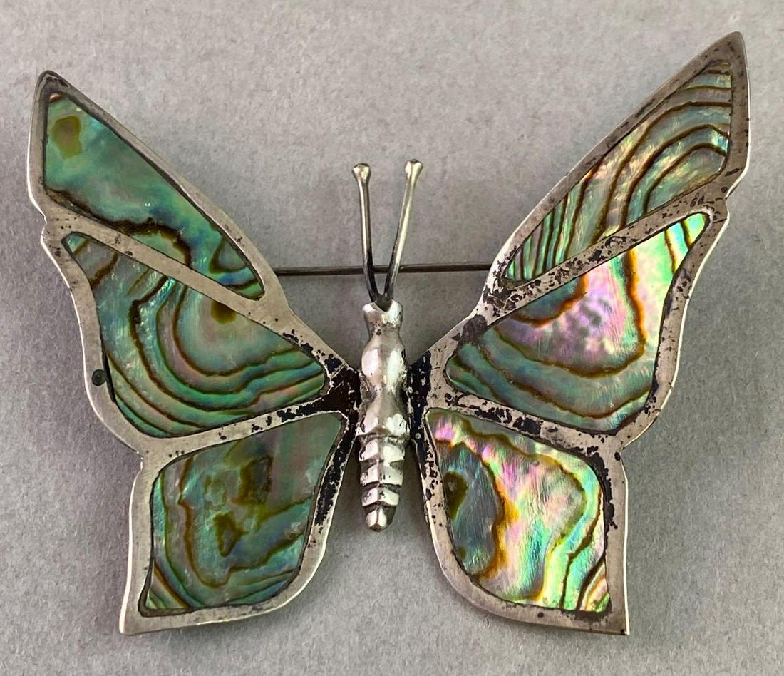 Abalone Shell Butterfly Brooch Sterling Silver: Sterling Silver and abalone brooch measures approximately 2 1/8 inches wide.