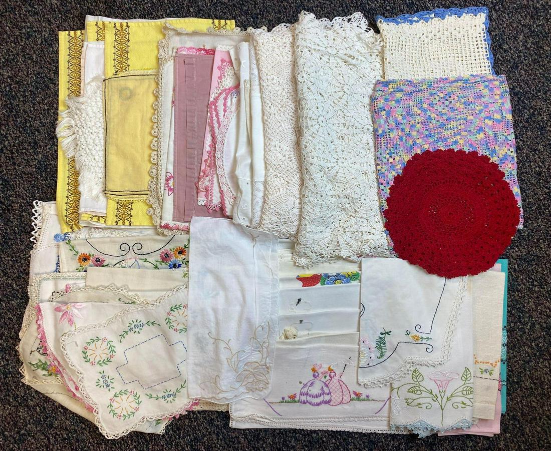 Group of assorted small linens and doilies: Embroidered hand towels, placemats, doilies, table runners, and more. Appx 60 pieces, largest is appx 84x15 inches