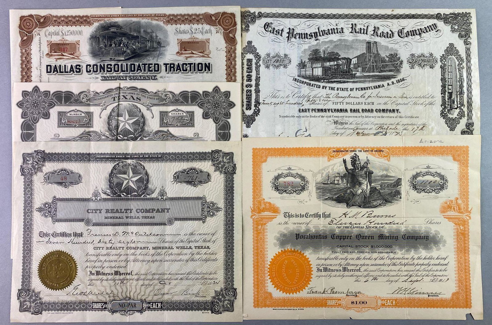Group of 5 Stock Certificates Late 19th Early 20th: Includes stock certificates from 1890s Dallas Consolidated Traction, 1920 Walker Consolidated Petroleum Company, 1934 City Realty Company, 1873 East Pennsylvania Rail Road Company, and 1918 Pocahontas