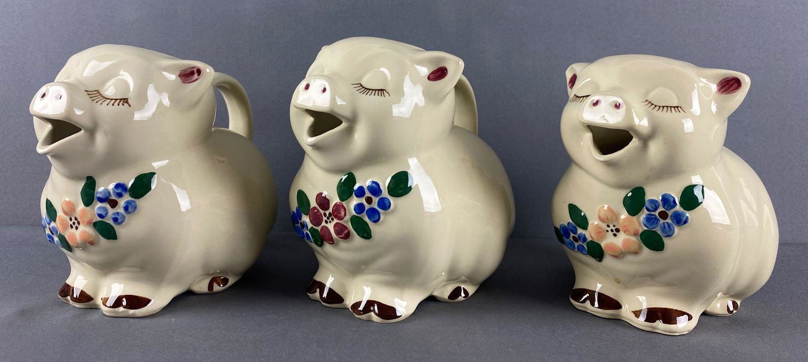 Group of 3 Shawnee Pottery Smiley Pig pitchers (1 of 5)