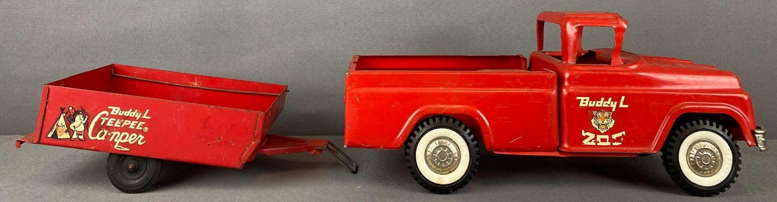 2 piece group Buddy L pressed steel pickup truck and: Buddy L Traveling Zoo Truck-13x5x5.5 inches and Buddy L TeePee Camper Trailer. Most original paint and decals remain