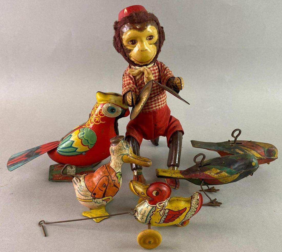 Group of 6 Wind Up Tin Toys: Includes Chein, Birds, Monkey, Parrot and 1bird work. Monkey measures approximately 9 x 3 1/2 inches.