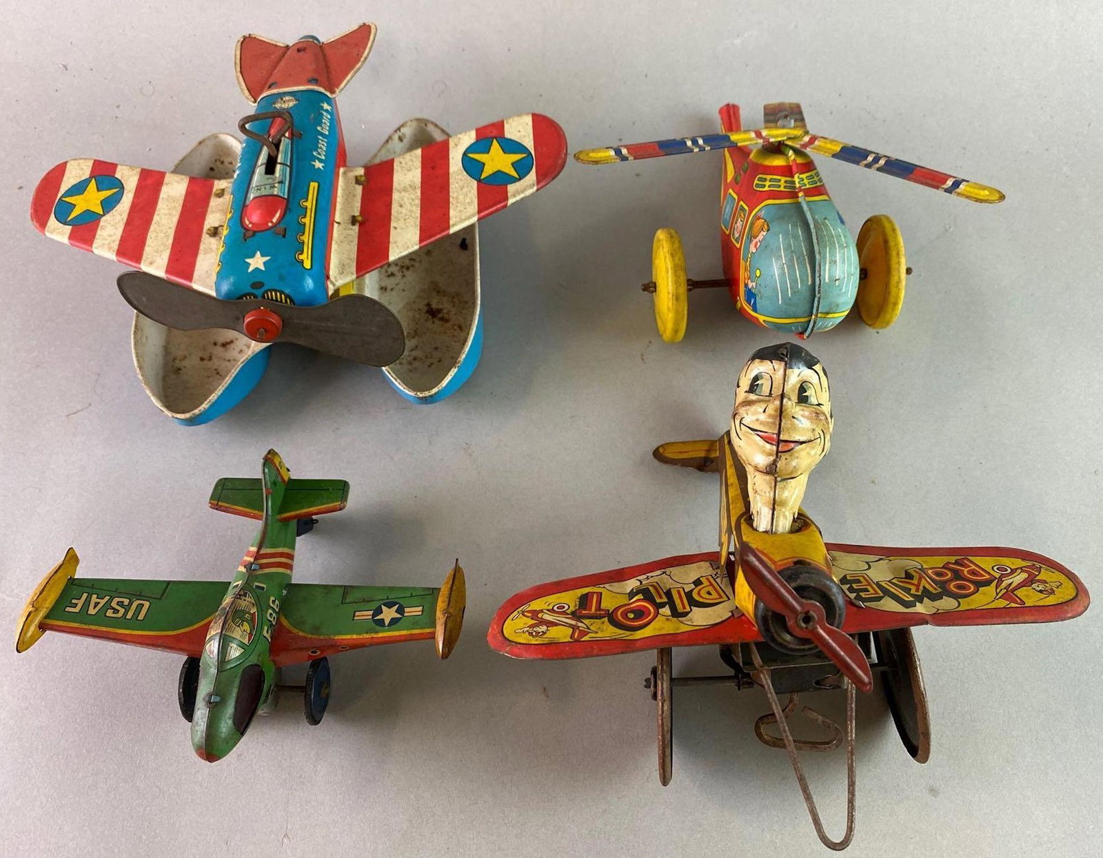 Group of 4 Wind Up Tin Toy Aircraft: Not working. Helicopter measures approximately 7 x 4 inches.