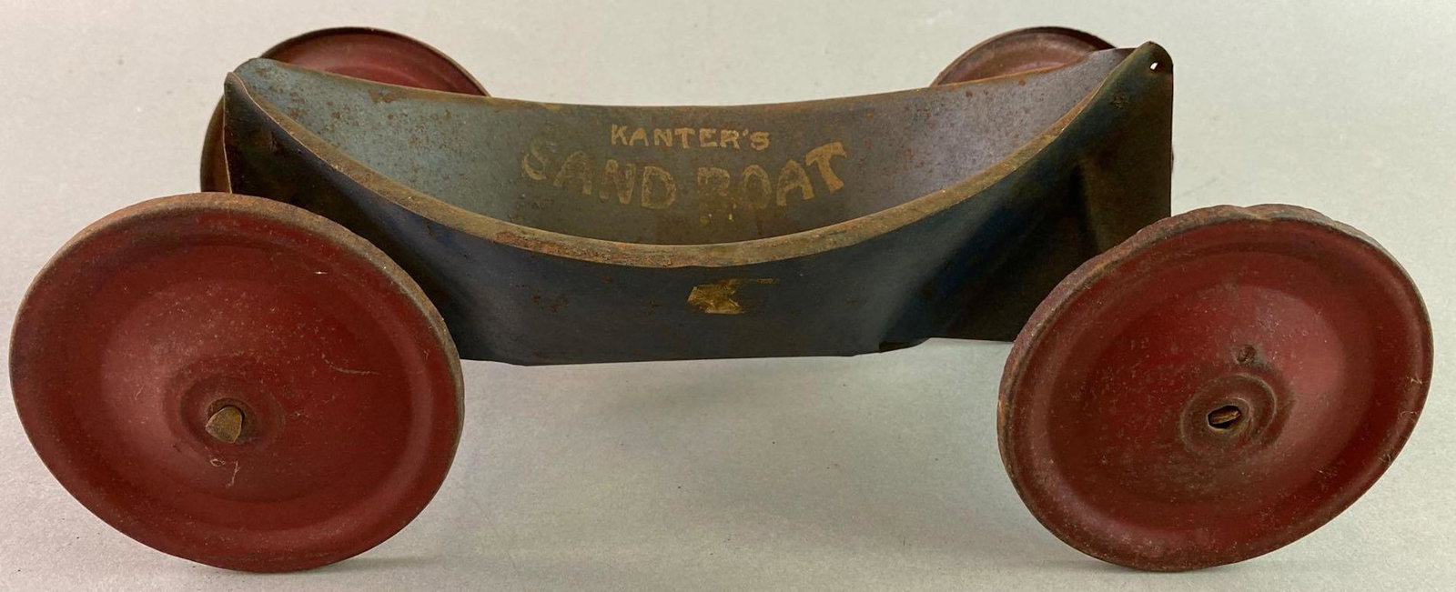 Kanters Sand Boat Antique Tin Toy: Measures approximately 13 x 4 1/4 inches.