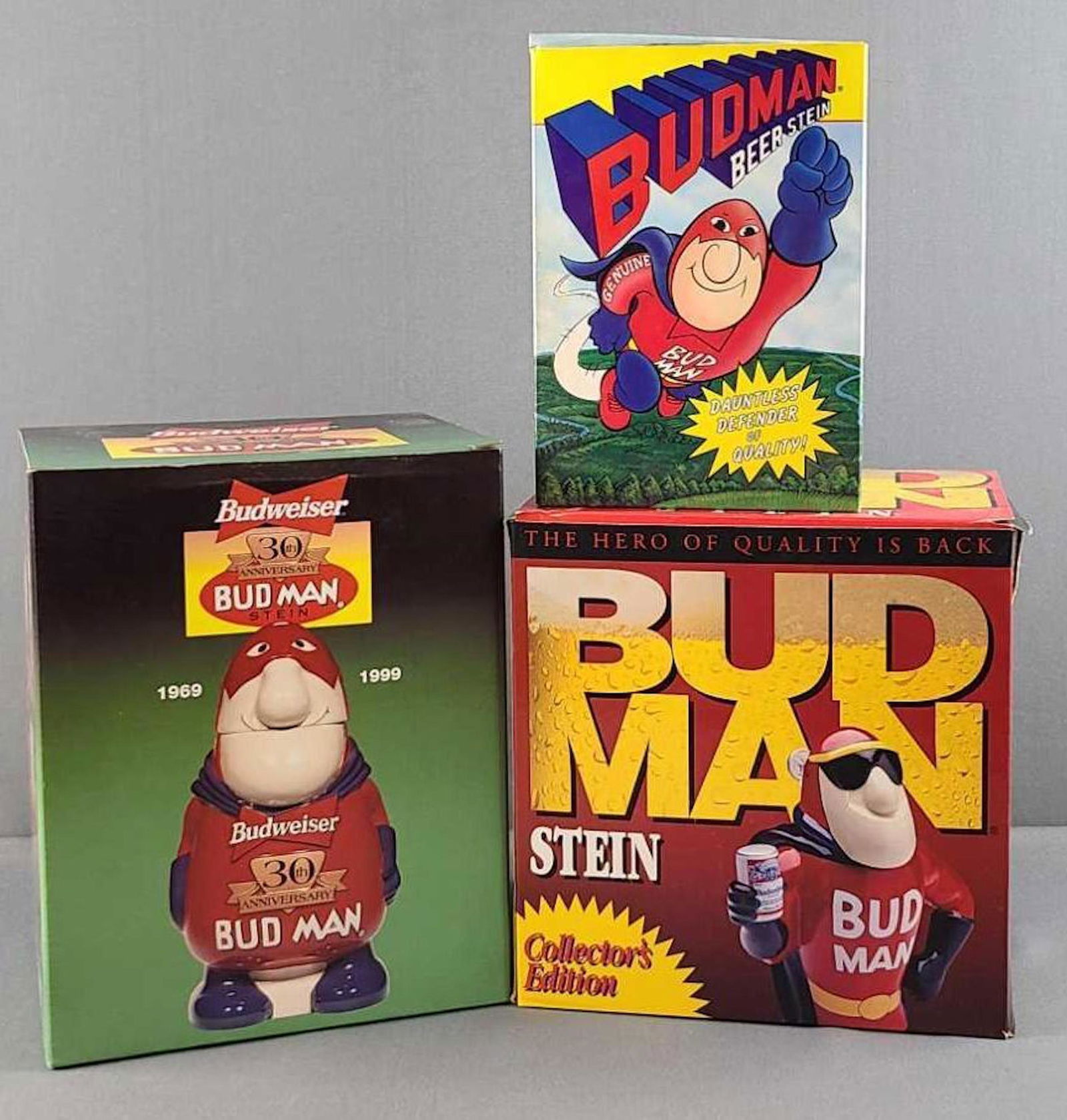 Group of 3 Bud Man beer steins: In original boxes. Tallest 8 inches