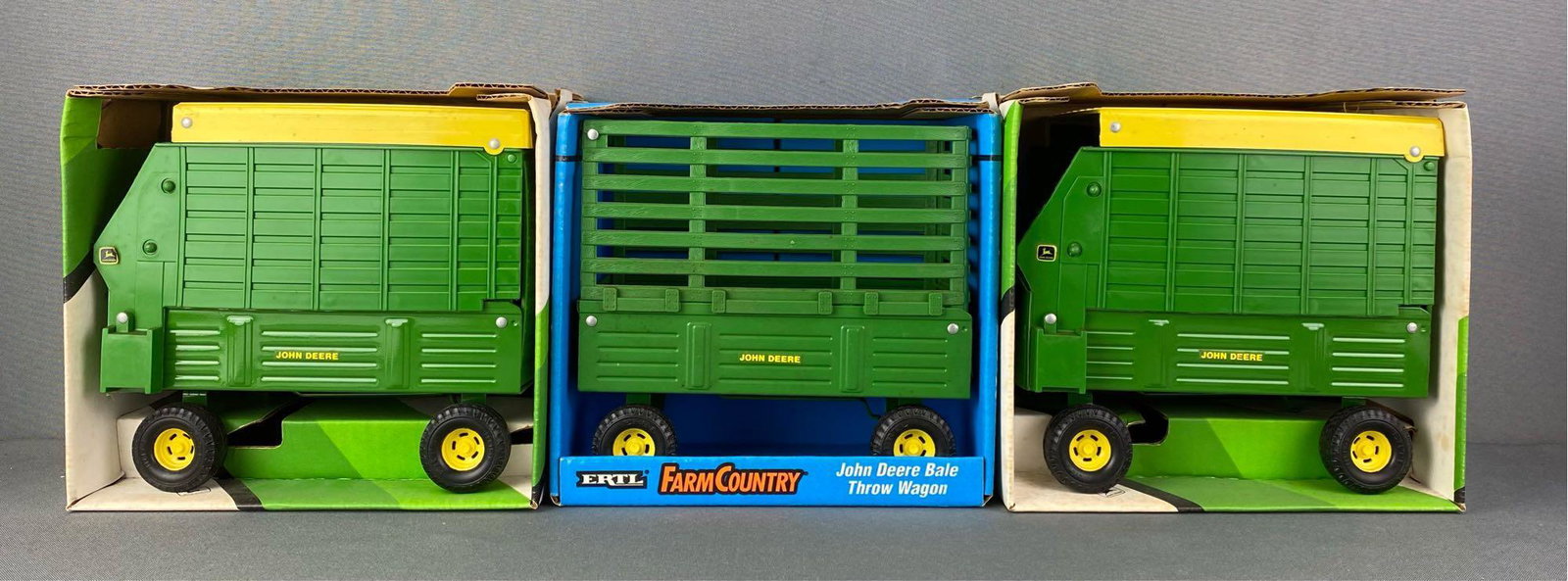 Group of 3 ERTL Tractor Wagons: Includes 2 #510 Forage Wagons and 1 #522 John Deere Bale Throw Wagon, 1/16 scale