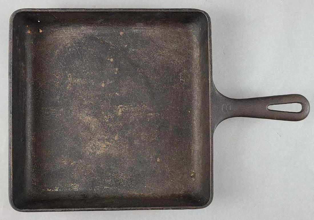 Griswold cast iron square fry skillet: Cast iron, 28, A. 9.5 x 9.5 inches. Lays flat. No wobble.