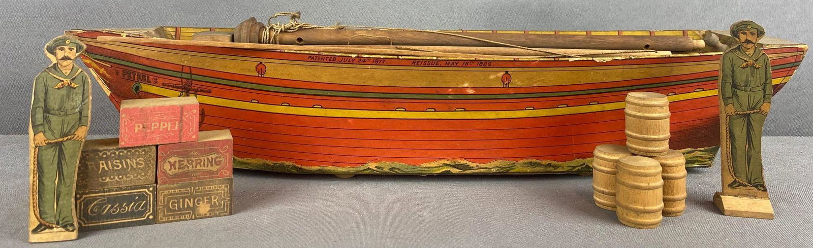 Lithograph Paper on Wood pull-along toy fishing boat: Includes cargo, sailors. Appx 19.5x5x3.25 inches as pictured
