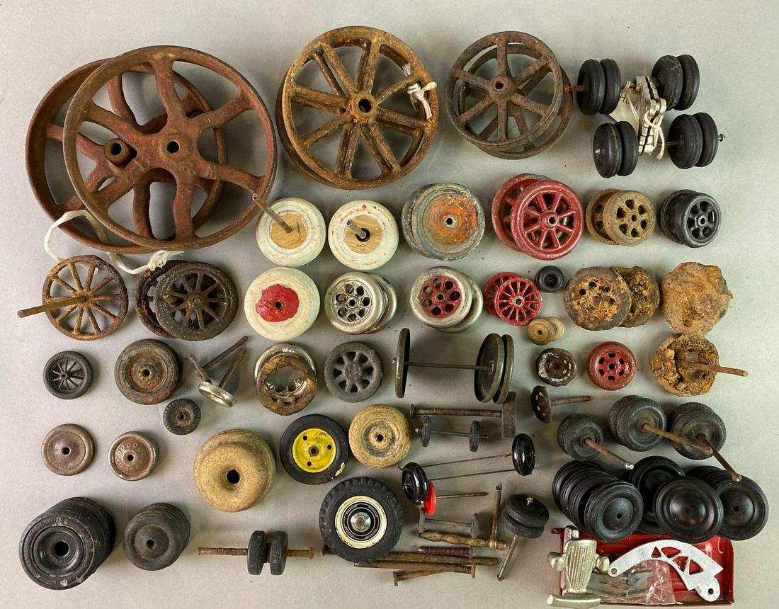 Large Group of Wheels Axles for Antique Toys: Includes rubber, cast iron, wood, and plastic wheels, antique and reproduction.