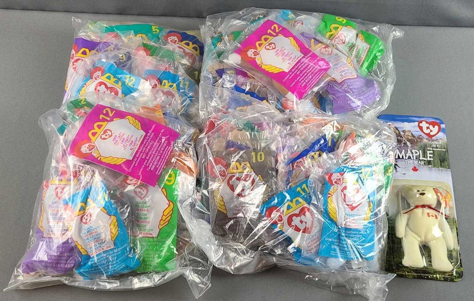 Group of McDonalds teeny beanie babies and more: Happy meal bags. Sealed in original packaging