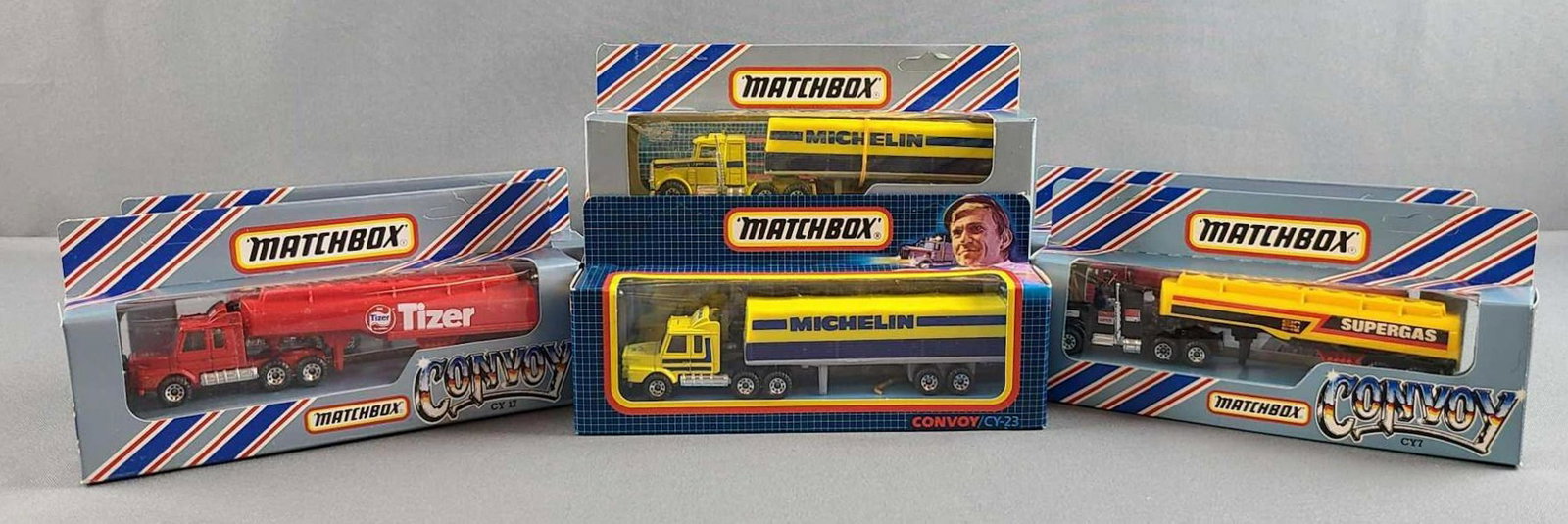 Group of 12 Matchbox Convoy die cast trucks: In original packaging. CY 23, 7, 17, 5