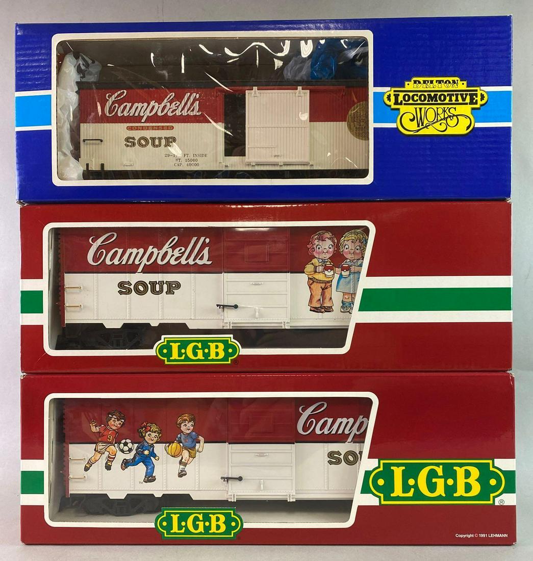 Group of 3 G Gauge Campbell Soup Boxcars: Includes 2 LGB boxcars and 1 Delton boxcar.