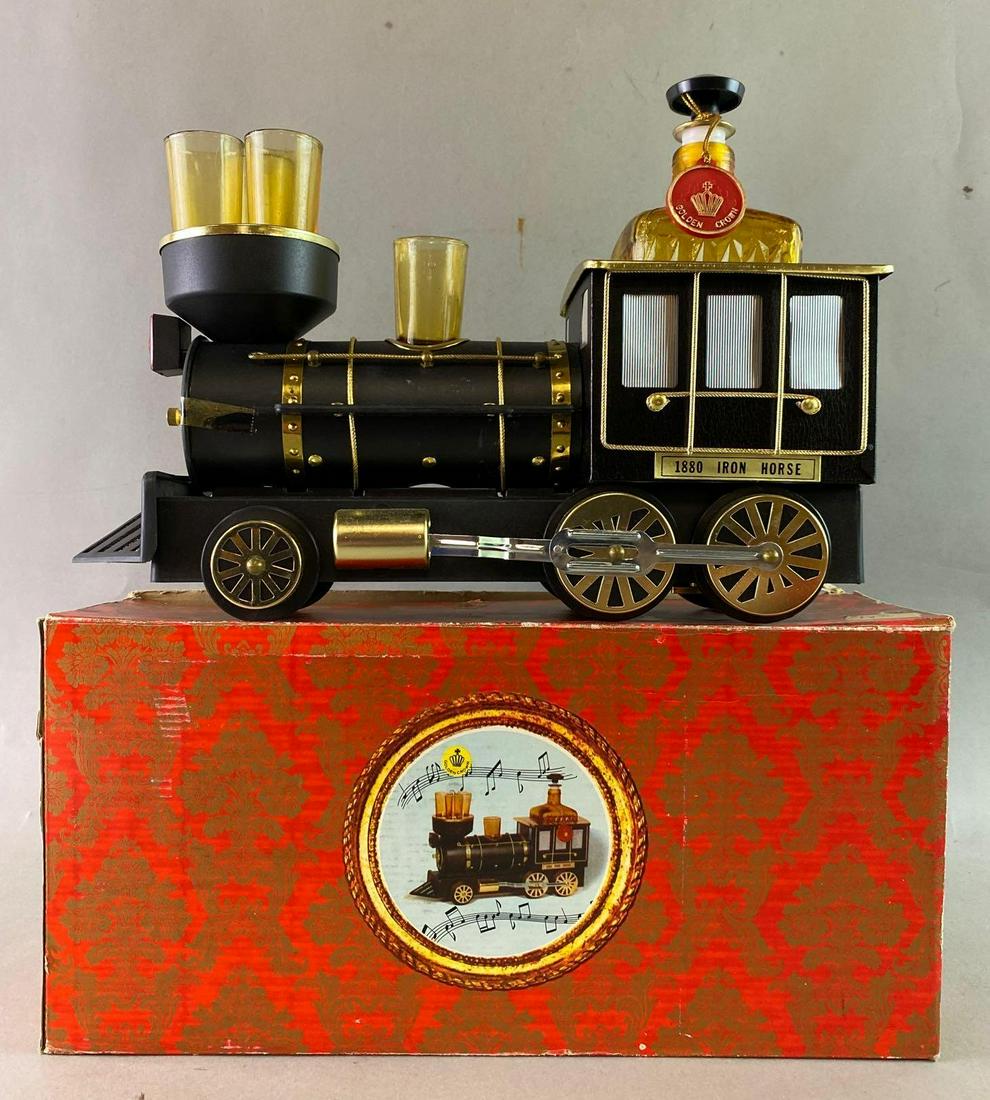 Locomotive Decanter and Shot Glasses: Music box is overwound. Measures approximately 12 1/2 x 7 1/2 inches.