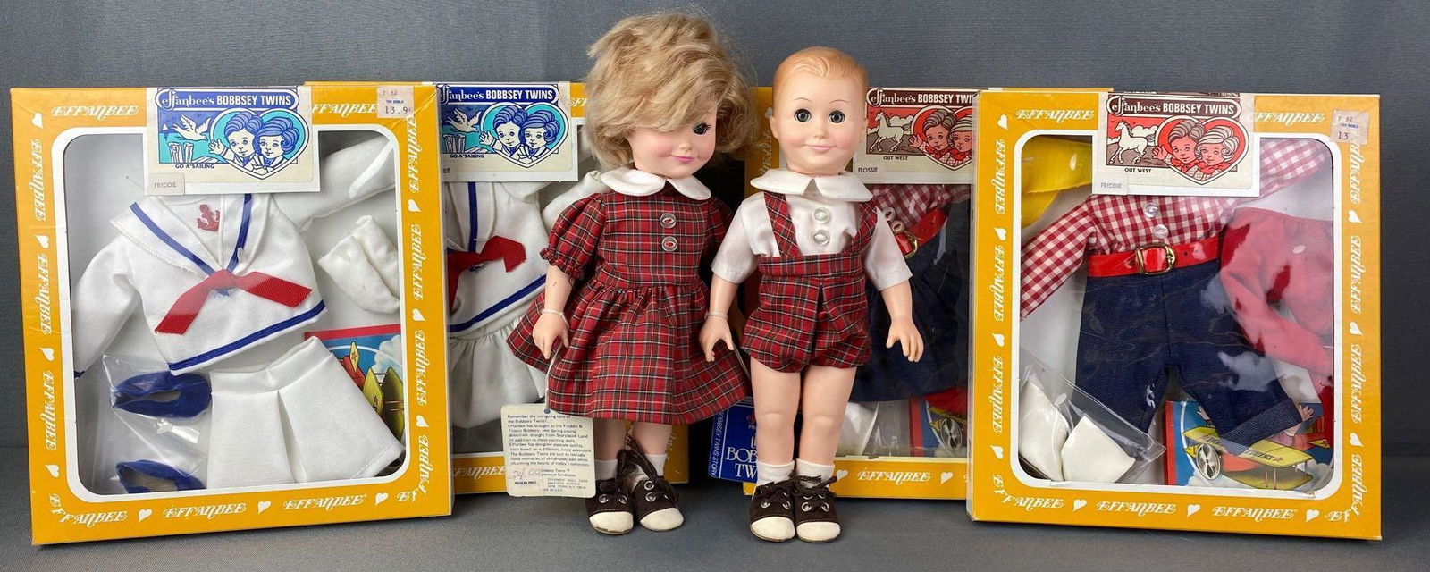 Group of Effanbee Bobbsey Twins and Clothes: Includes Go A Sailing and Out West outfits, Freddie and Flossie, circa 1980s