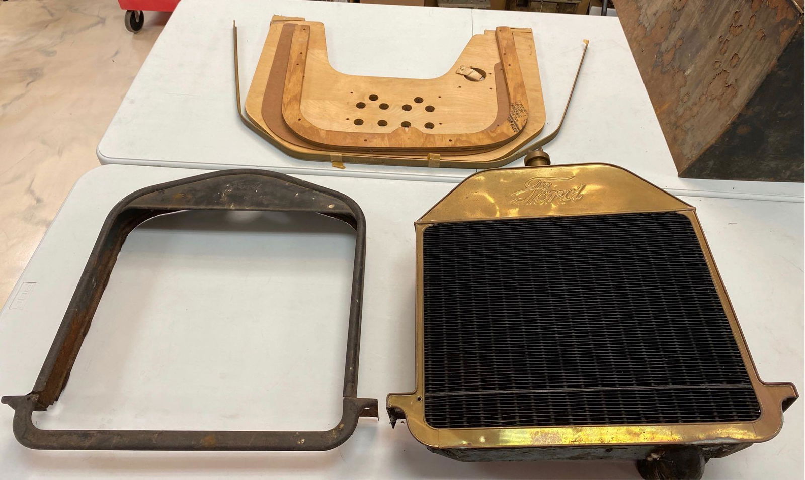 Group of Ford Model T Parts Radiator Shells Forming: Radiator with brass shell measures approximately 23 x 26 inches.