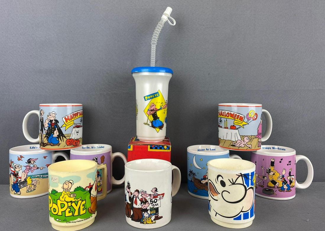 Group of 11 Popeye mugs, water bottle: Ceramic, plastic. Largest is 6 inches