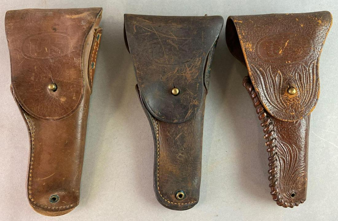 Group of 3 WW2 US Holsters. 1 Identified: Holsters are dated 1942, 1943, and 1944. The hand tooled holster measures 10 x 5 inches.
