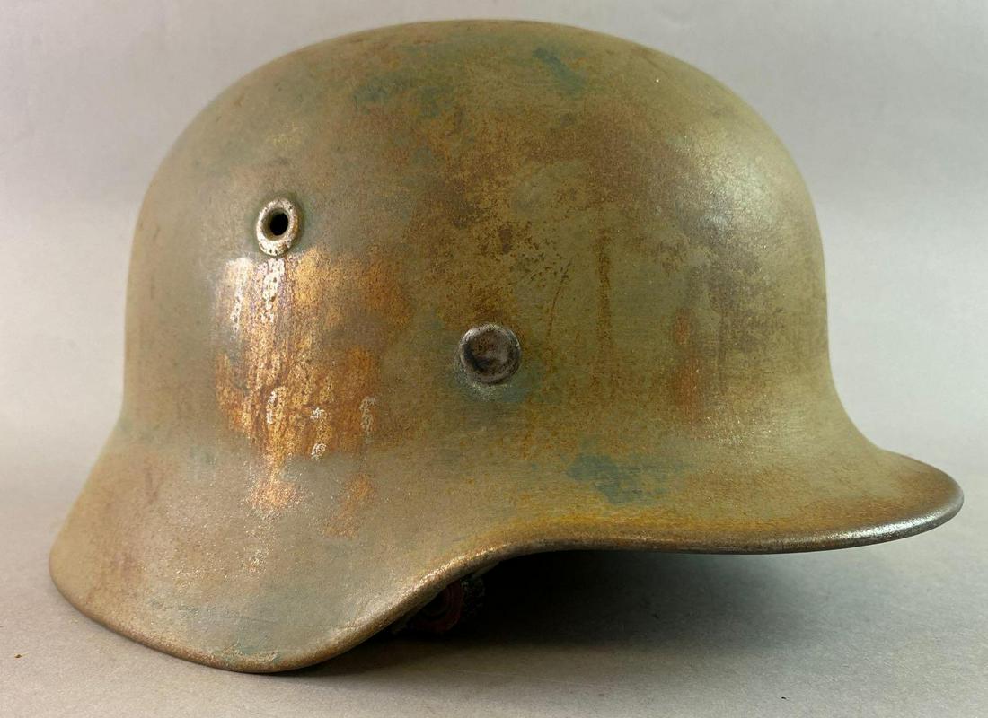 WW2 German M40 Helmet: Identified. Manufacturer mark of Q64 . Manufactured by the Quist Factory. Size 64. Size 64. The decals were scraped off.
