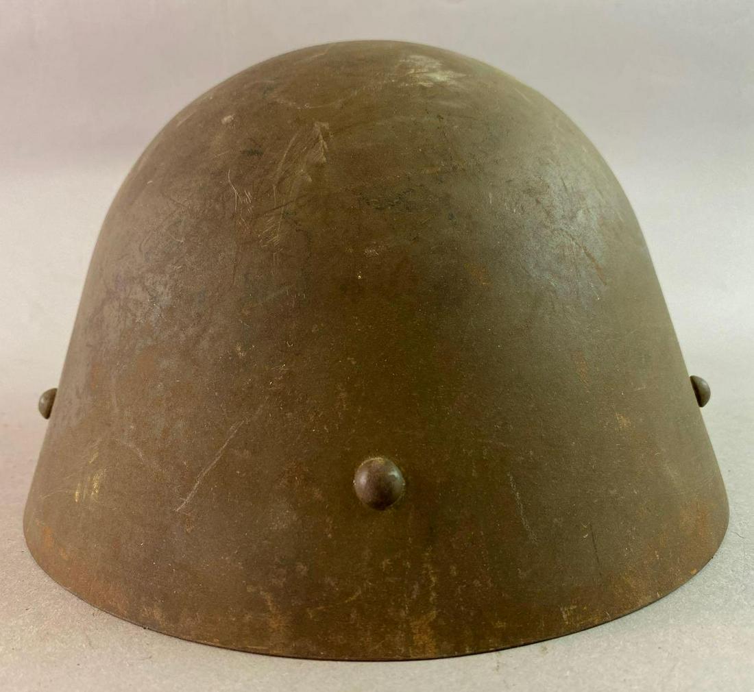 WW2 Czech M32 Helmet: With original chinstrap. Stamped SDH35. Manufactured by Sandrik in Dolnï¿½ Hï¿½mre in Slovakia. Issued in 1935.