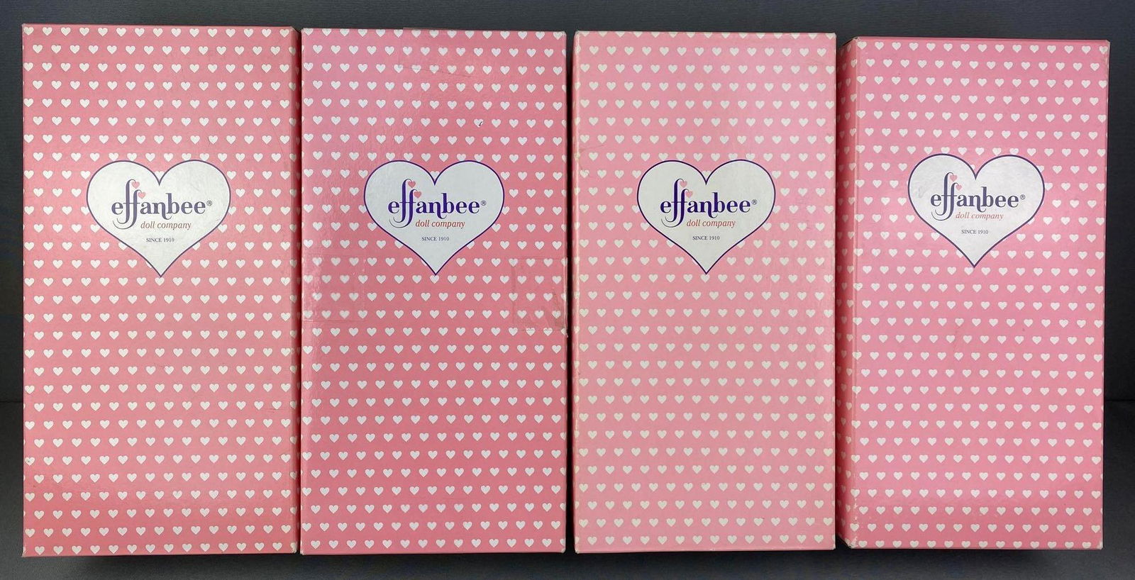 Group of 4 Effanbee Dolls: Includes Holiday Patsy, Candy Kid Boxer, FAO Schwarz Exclusive Patsy, and Doll Classics Grande Finale Patsy. All in original a boxes, 12.5 inches