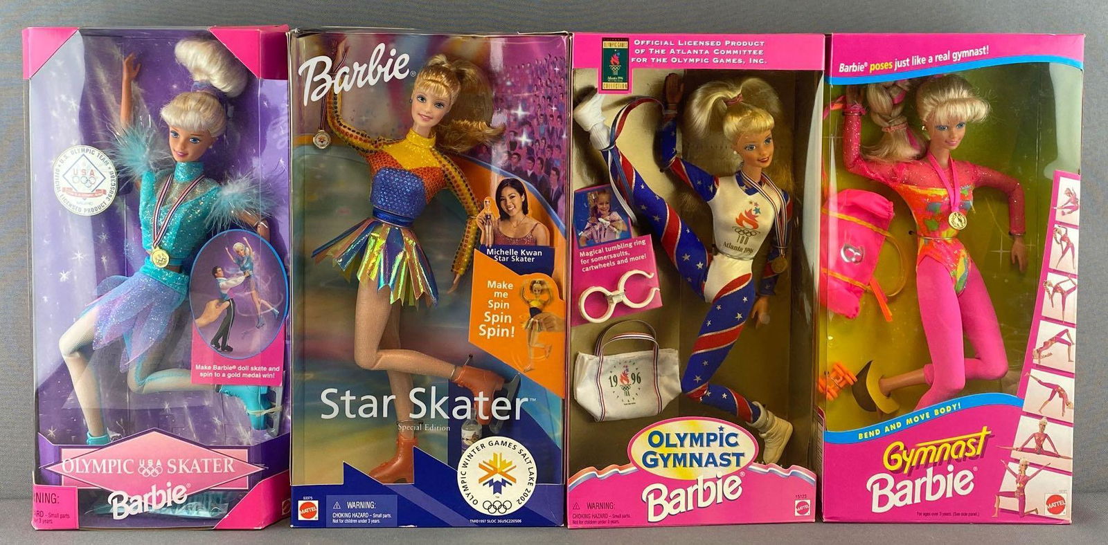 Group of 4 Olympic Games Barbies: Olympic Skater, Star Skater, Olympic Gymnast and Gymnast Barbie. 11.5 inch dolls, new in original packaging. 1994-1997 Mattel, Inc