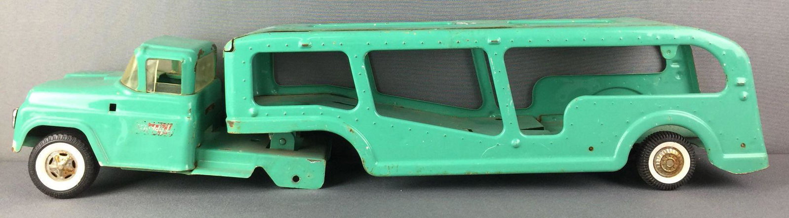 Buddy L Teal Transporter Truck: Some scratches, some rust, missing two wheels, 25.5X5X5.5 inches