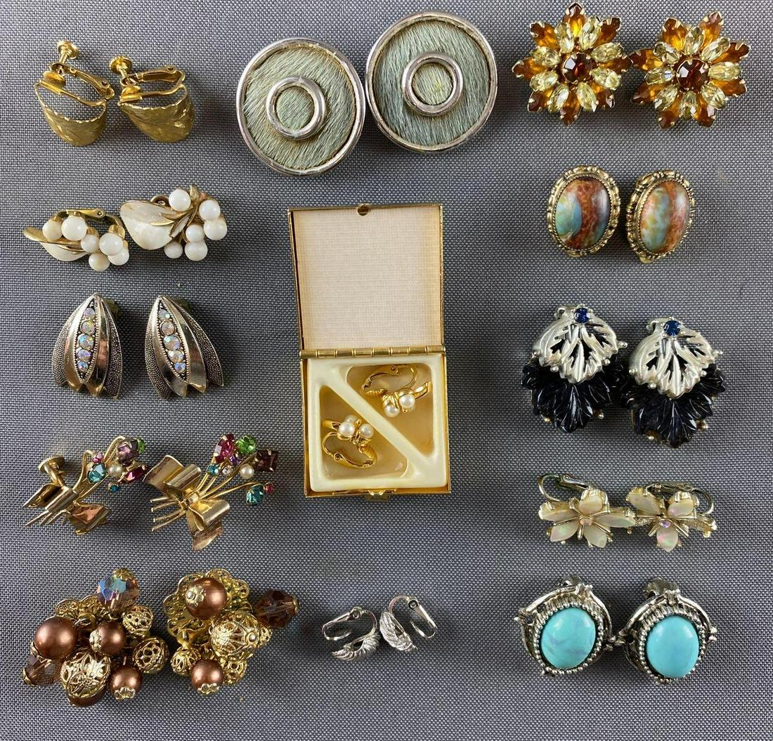 Group of 13 pairs assorted clip and screw-back earrings: Kramer of NY, Napier, Trifari, and more. Largest is 1.25 inches