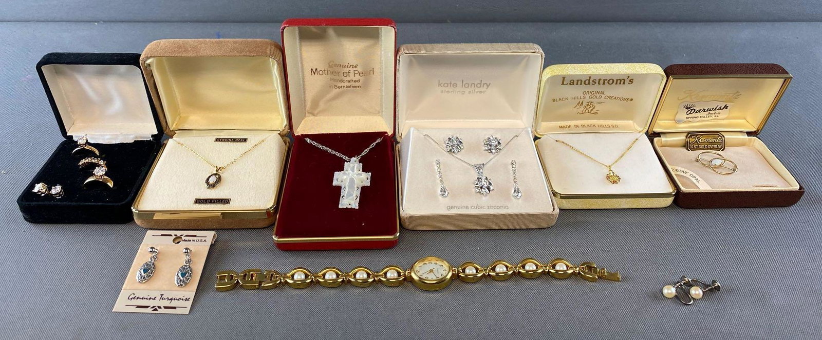 9 piece group of assorted jewelry, sets: Mother-of-Pearl, Opal, Turquoise, Cubic Zirconia, Black Hills Gold. Watch is 8.5 inches overall