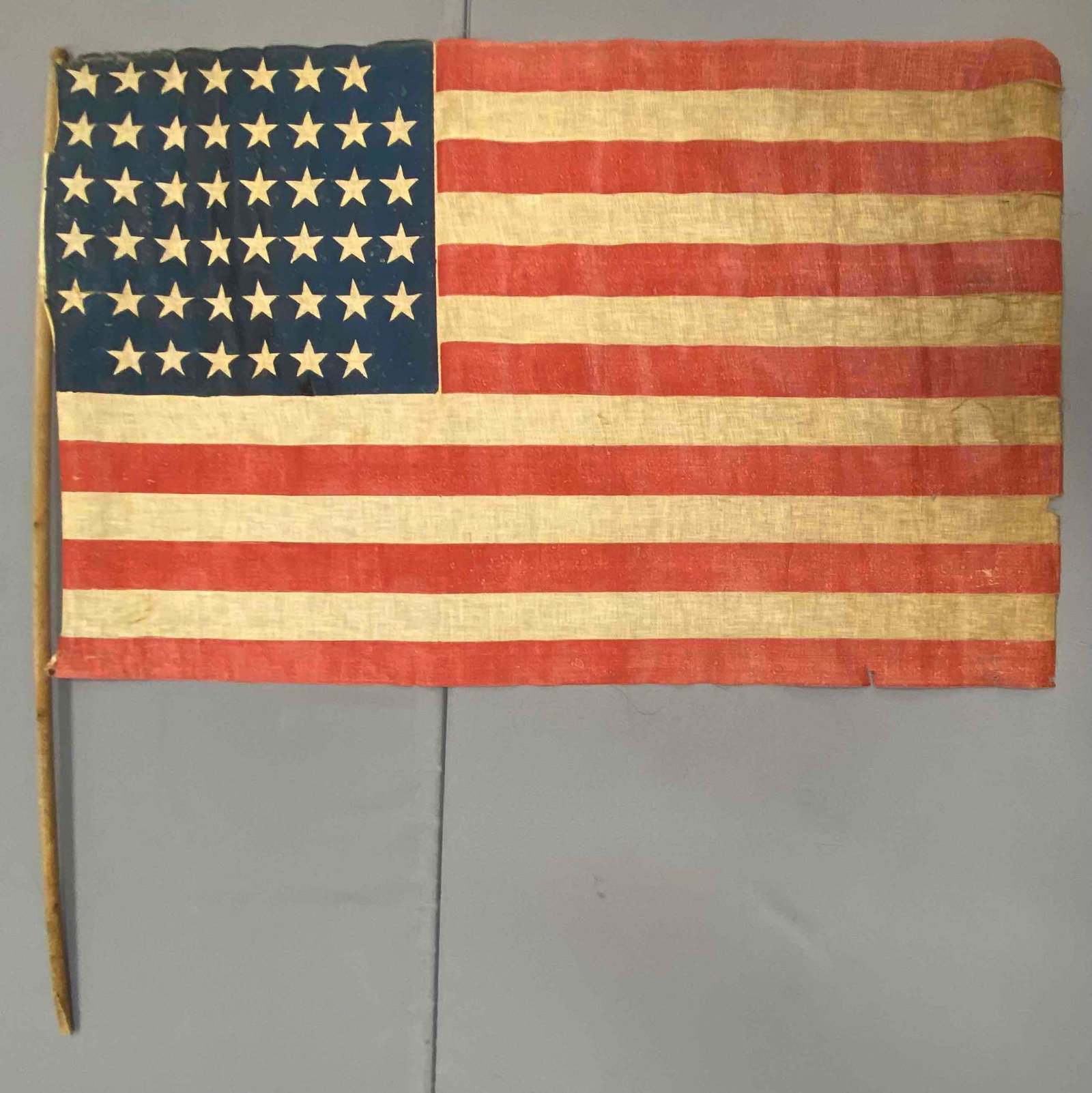 45 Star Flag: Measures 47 x 30 inches. Has some staining and damage.